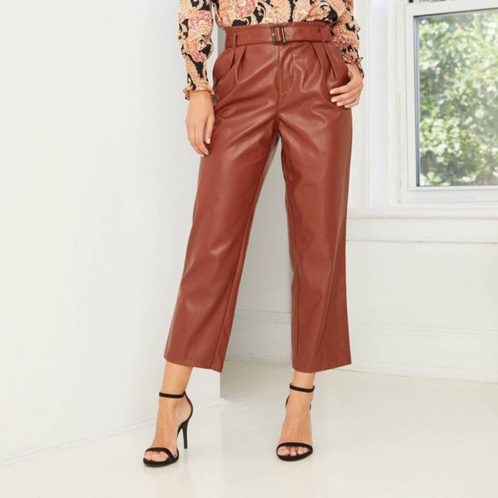 Belted maroon faux leather pants